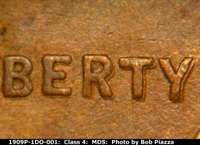 Die-stage B marker on 1909P•1DO•001 showing Doubling seen on LIBERTY.