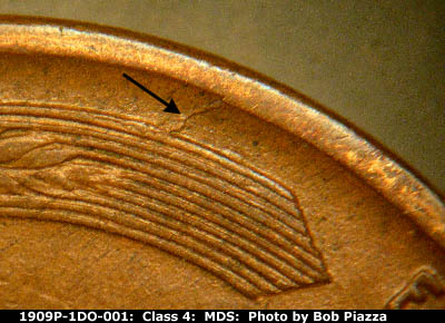 Die-stage B marker on 1909P•1DO•001 showing die crack shows from the rim at k-10 to the upper left wheat lines.