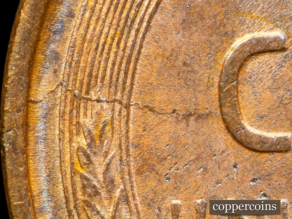 Die-stage F marker on 1909P•1DO•002 showing Die Crack at K9 extends from Rim to C of CENT.