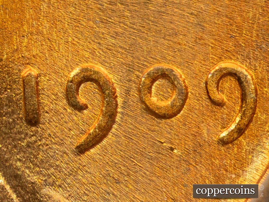 Die-stage D marker on 1909P•1DO•002 showing Extra Thickness on Date.