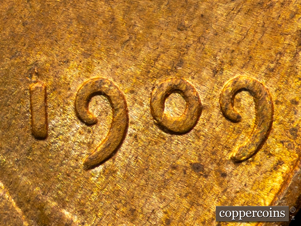 Die-stage B marker on 1909P•1DO•002 showing Extra thickness on the Date.