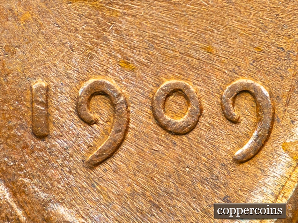 Die-stage F marker on 1909P•1DO•002 showing Extra Thickness on Date.