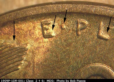 Die-stage B marker on 1909P•1DR•001 showing Extra thickness on EPU and left wheat tip.