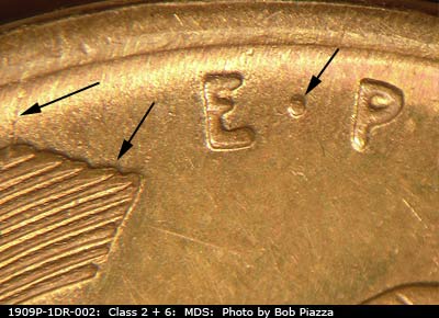 Die-stage B marker on 1909P•1DR•002 showing Extra thickness on EPU, whith doubling on left wheat stalk tip.