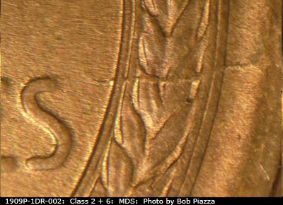 Die-stage B marker on 1909P•1DR•002 showing Die crack through middle right wheat stalk.