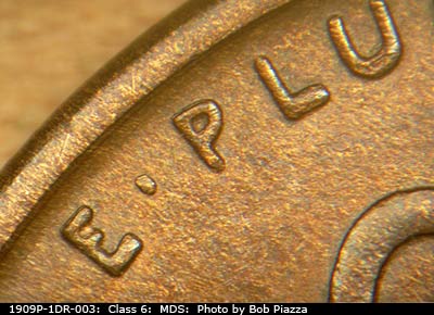 Die-stage B marker on 1909P•1DR•003 showing Extra thickness on EPU.