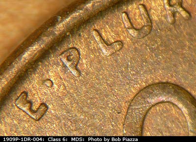 Die-stage B marker on 1909P•1DR•004 showing Extra thickness on EPU.
