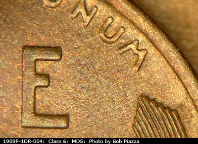 Die-stage B marker on 1909P•1DR•004 showing Extra thickness shows on E PLURIBUS UNUM.