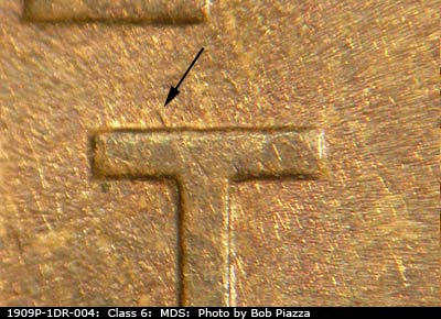 Die-stage B marker on 1909P•1DR•004 showing Die gouge from top of T in CENT.