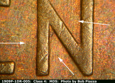 Die-stage B marker on 1909P•1DR•005 showing N-S die scratches through the N of CENT.