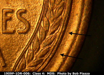 Die-stage B marker on 1909P•1DR•006 showing Heavy die scratch parallels just outside the lower right wheat.