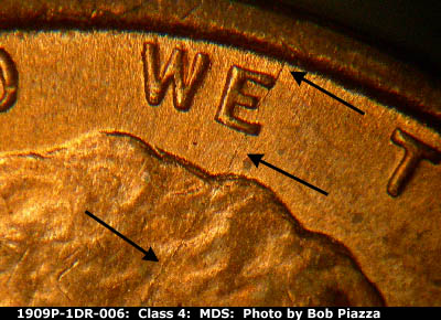 Die-stage B marker on 1909P•1DR•006 showing Spiked head die crack runs from the rim through the E of WE to the head.