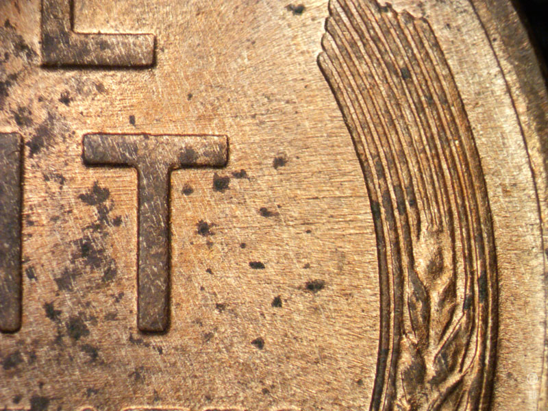 Die-stage B marker on 1909P•1DR•007 showing East to West die scratches showing through the T of CENT.