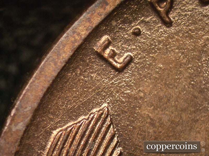 Die-stage A marker on 1909P•1DR•008P showing The number of thin die scratches show in the EP area of E pluribus unum.