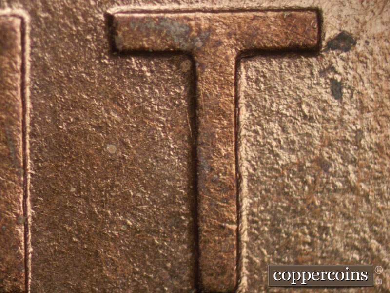 Die-stage A marker on 1909P•1DR•008P showing A die mark shows on the lower section of the T of CENT.