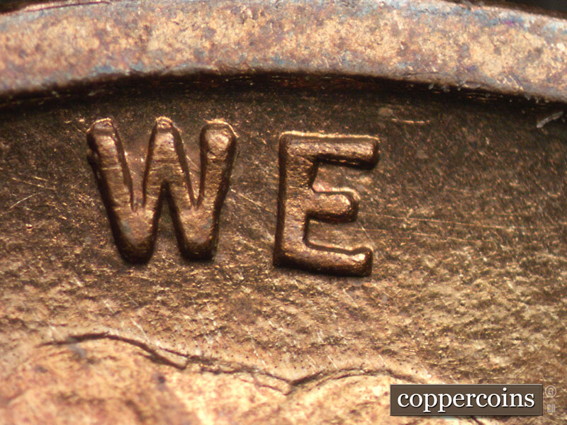 Die-stage A marker on 1909P•1DR•008P showing Thin die scratches from GOD extend through WE.