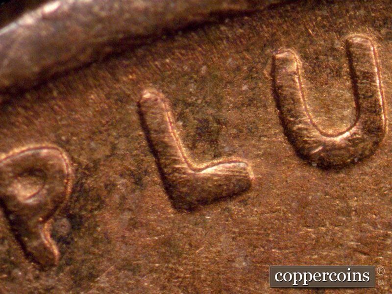 Die-stage B marker on 1909P•1DR•009 showing Thickness in PLURIBUS.