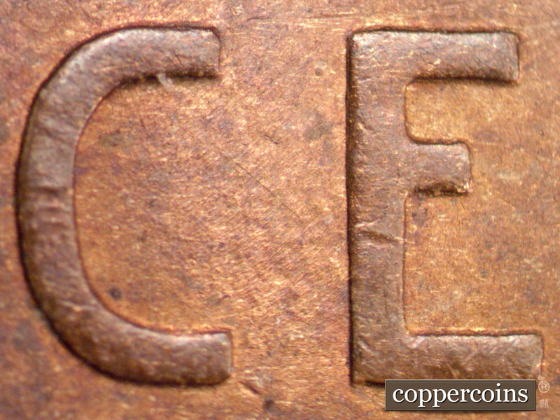 Die-stage B marker on 1909P•1DR•009 showing Diagonal die scratch midway between C and E of CENT.