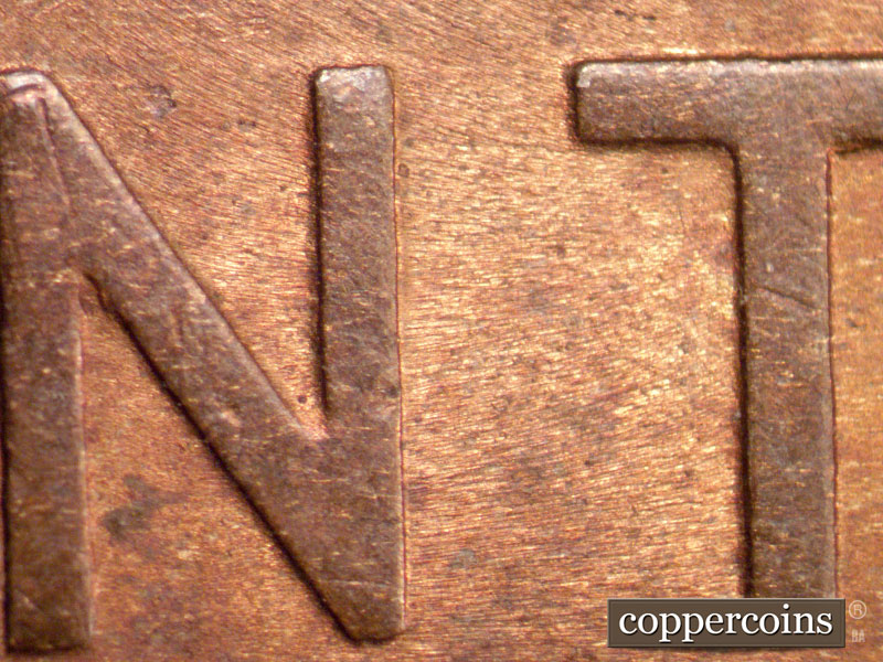 Die-stage B marker on 1909P•1DR•009 showing Die file lines running East to West.