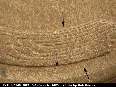 Die-stage B marker on 1910S•1MM•002 showing Concentric die scratches show outside the right upper wheat lines.