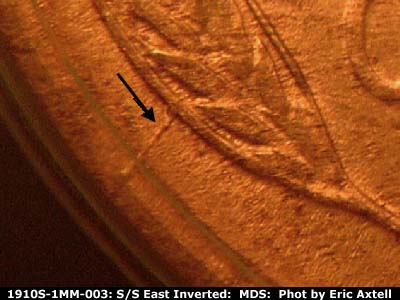Die-stage B marker on 1910S•1MM•003 showing A heavy die crack shows from the lower left wheat to the rim.