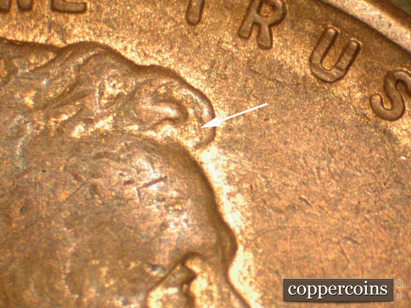 Die-stage B marker on 1910S•1MM•004 showing Die Scratch in the front of the hair.