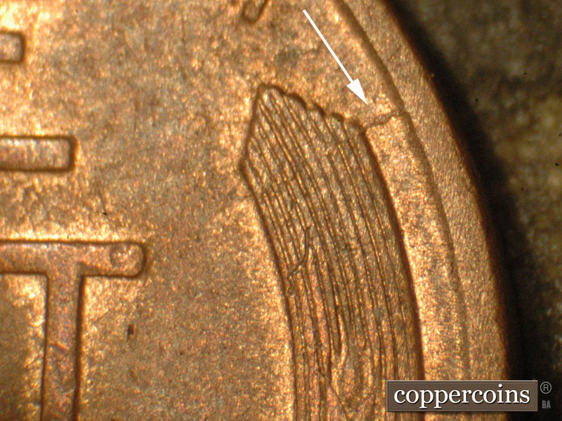 Die-stage B marker on 1910S•1MM•004 showing Die crack from the outer right tip of the wheat to the rim.