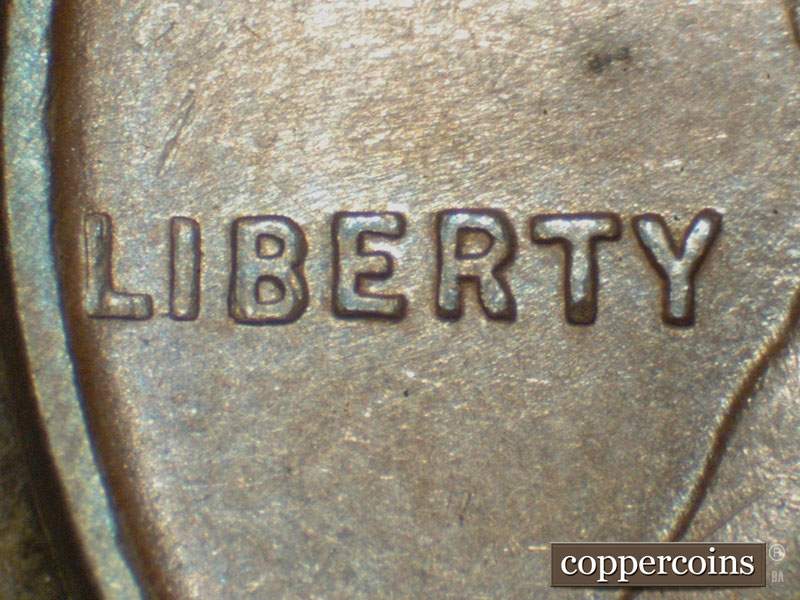 Die-stage C marker on 1911D•1MM•001 showing Small die Gouge extends to the left from the lower corner of the I of Liberty.