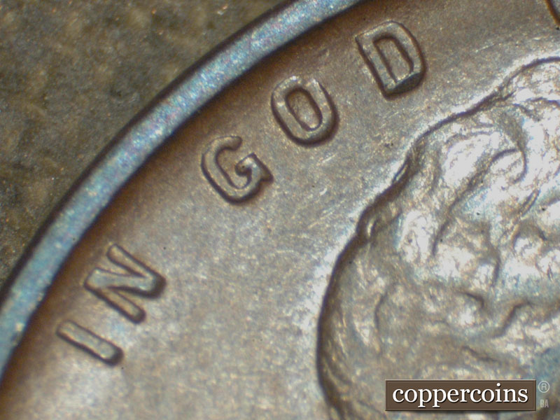 Die-stage C marker on 1911D•1MM•001 showing Small die Gouges extend to the West from the top of the D of God.