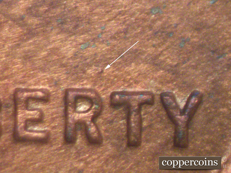 Die-stage A marker on 1911D•1MM•002 showing Die dot above the R of LIBERTY.