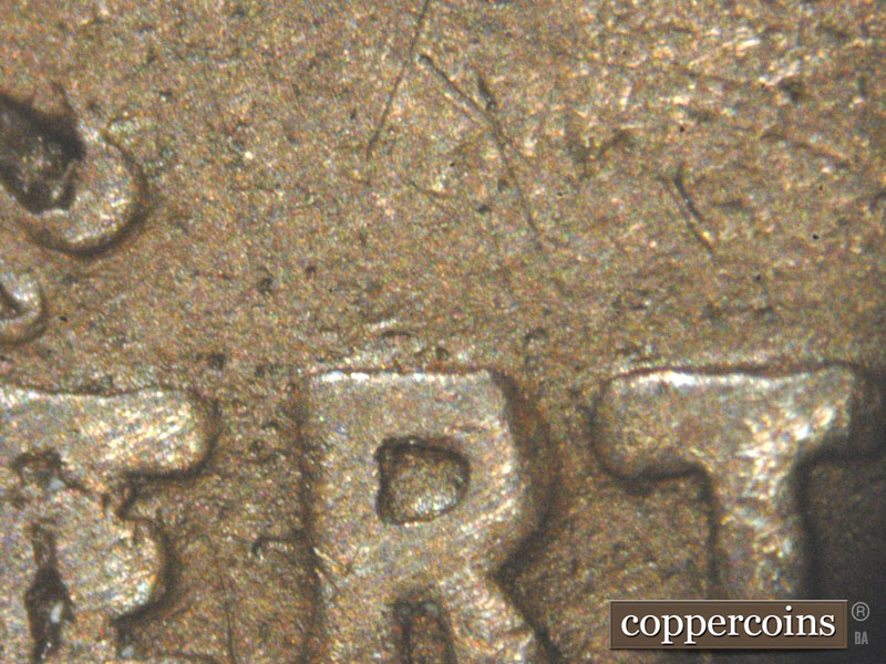 Die-stage C marker on 1911D•1MM•002 showing The area around the ERT of Liberty showing what could be damage and could be a die marker. We will need to examine a….