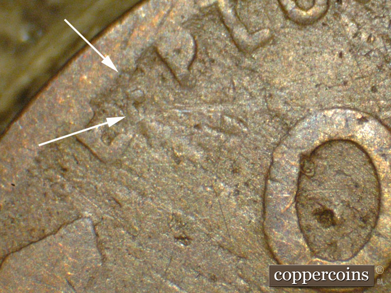 Die-stage C marker on 1911D•1MM•002 showing An apparent die crack shows from the dot between E and P of E pluribus unum.