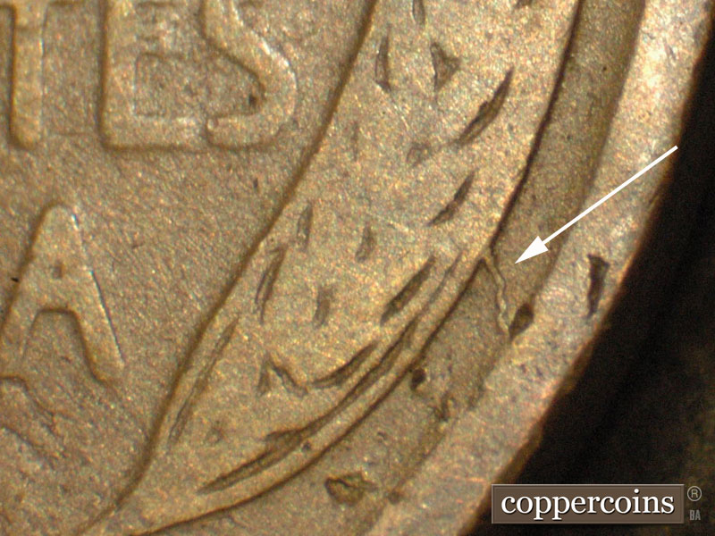 Die-stage C marker on 1911D•1MM•002 showing Die Crack shown going down to the rim from the 4th right wheat grain.