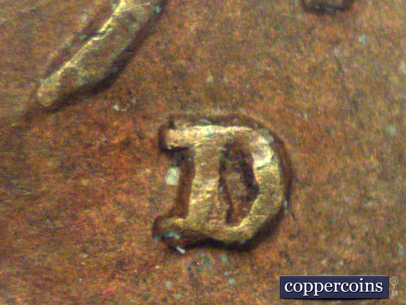 Die-stage A marker on 1911D•1MM•003 showing Secondary D punched north/northeast of primary.