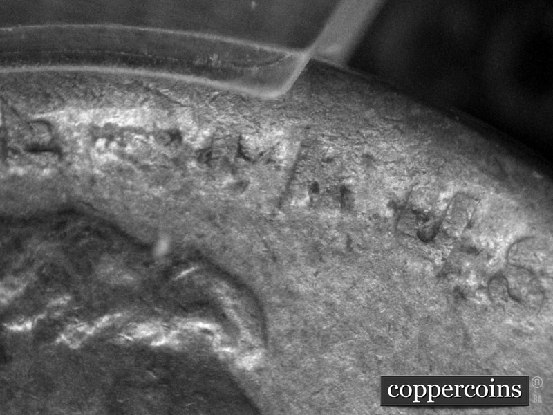 Die-stage C marker on 1911D•1MM•003 showing Die dot to lower left of R of TRUST is worn away.