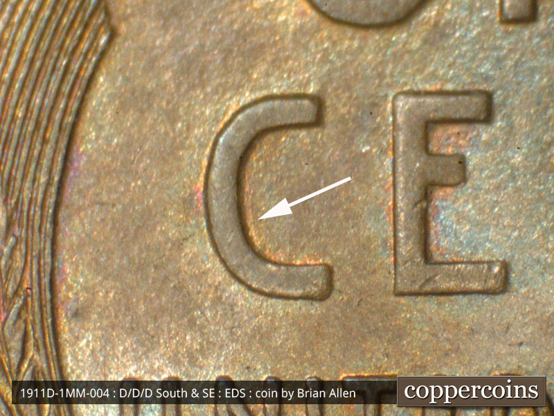 Die-stage A marker on 1911D•1MM•004 showing A die scratch runs generally N-S inside the C of CENT.