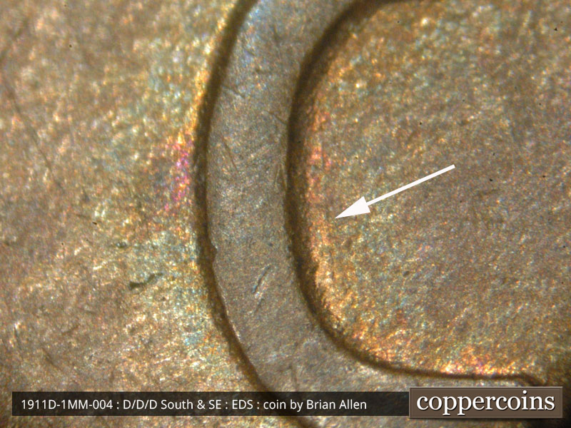 Die-stage A marker on 1911D•1MM•004 showing Close-up of the die scratch inside the C of CENT.
