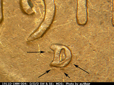 1911 Lincoln cent obverse, CopperCoins die 1911D•1MM•004 — Arrows indicate the areas to watch for raised bumps forming the secondary mintmark.
