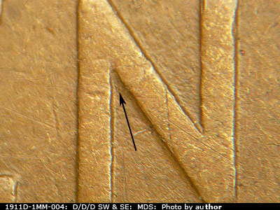 Die-stage B marker on 1911D•1MM•004 showing Die scratches are visible in the upper left protected angled area in the N of CENT.