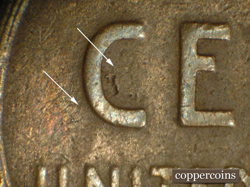 Die-stage C marker on 1911D•1MM•005 showing SW-NE die scratches show where indicated around the C of CENT.