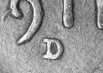 Die-stage B marker on 1911D•1OM•001 showing Closeup of D over S.