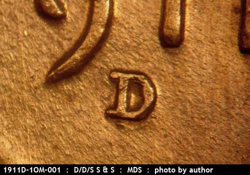 1911 Lincoln cent obverse, CopperCoins die 1911D•1OM•001 — A very long N-S die scratch shows between the 1 and 9 of the date.