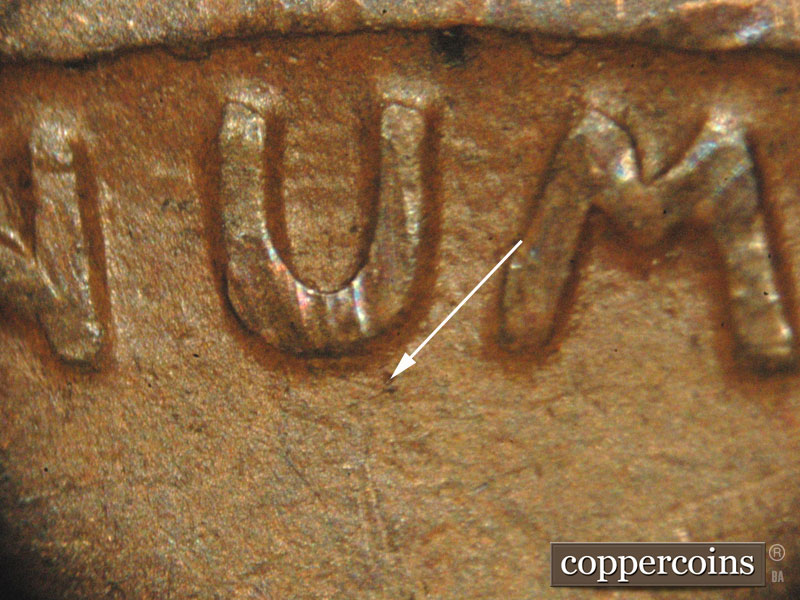 Die-stage B marker on 1912D•1MM•001 showing A short die scratch shows at the bottom of the U of PLURIBUS.