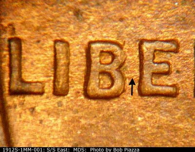 Die-stage B marker on 1912S•1MM•001 showing Die crack shows from the middle of the B to the middle of the E of LIBERTY.