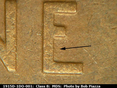 Die-stage B marker on 1915D•1DO•001 showing A few short die scratches show deep inside the lower half of the E of ONE.
