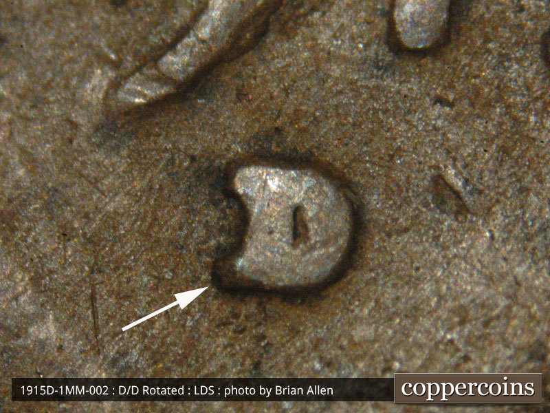Die-stage C marker on 1915D•1MM•002 showing Mintmark shows in a recess that will be present no matter the condition of the coin. Lower split serif shows.