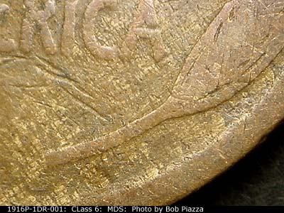 Die-stage B marker on 1916P•1DR•001 showing Lower Right section of the design showing the doubling on the wheat stem.