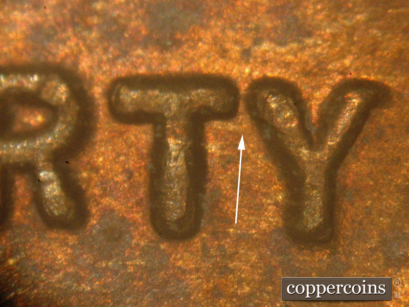 Die-stage C marker on 1917P•1DO•001 showing E/W die scratch connect TY in LIBERTY.
