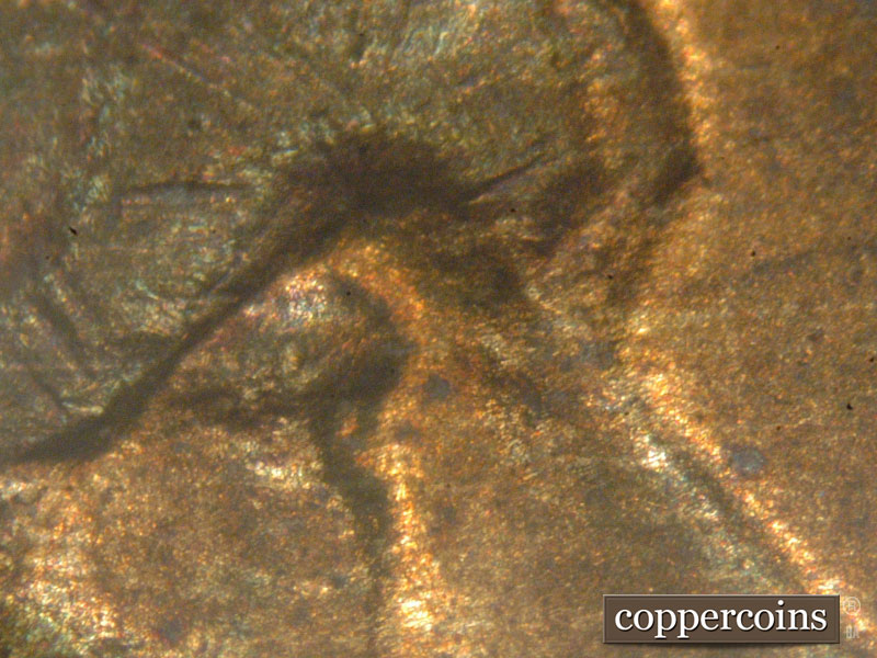 Die-stage C marker on 1917P•1DO•001 showing Photo of eye.