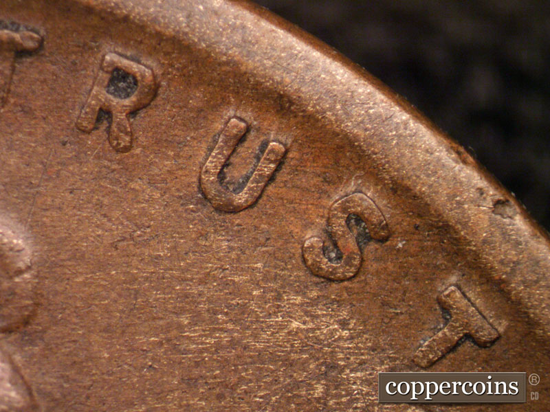 Die-stage B marker on 1919S•1DO•001 showing Light die scratching through TRUST.